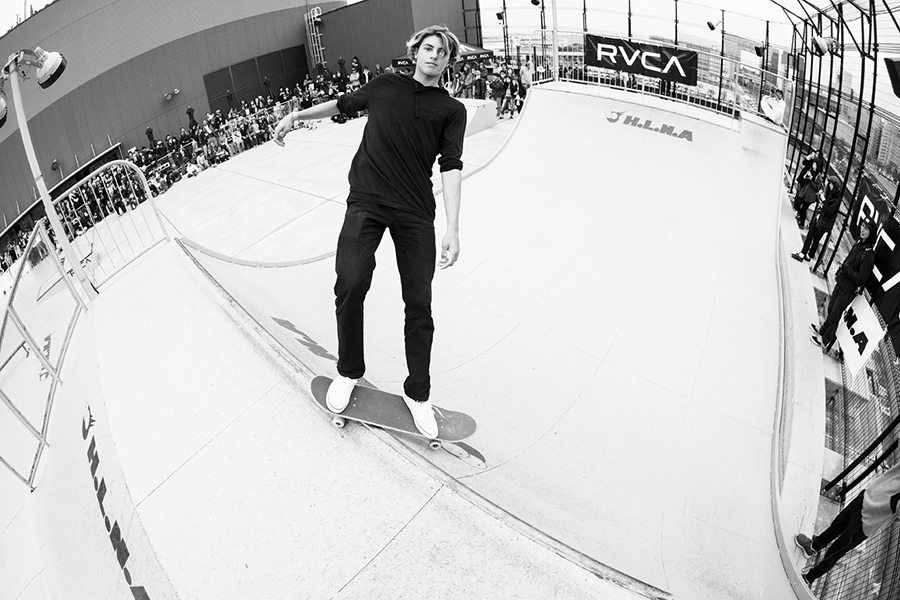 Curren Caples in feeble on the coping watching the camera